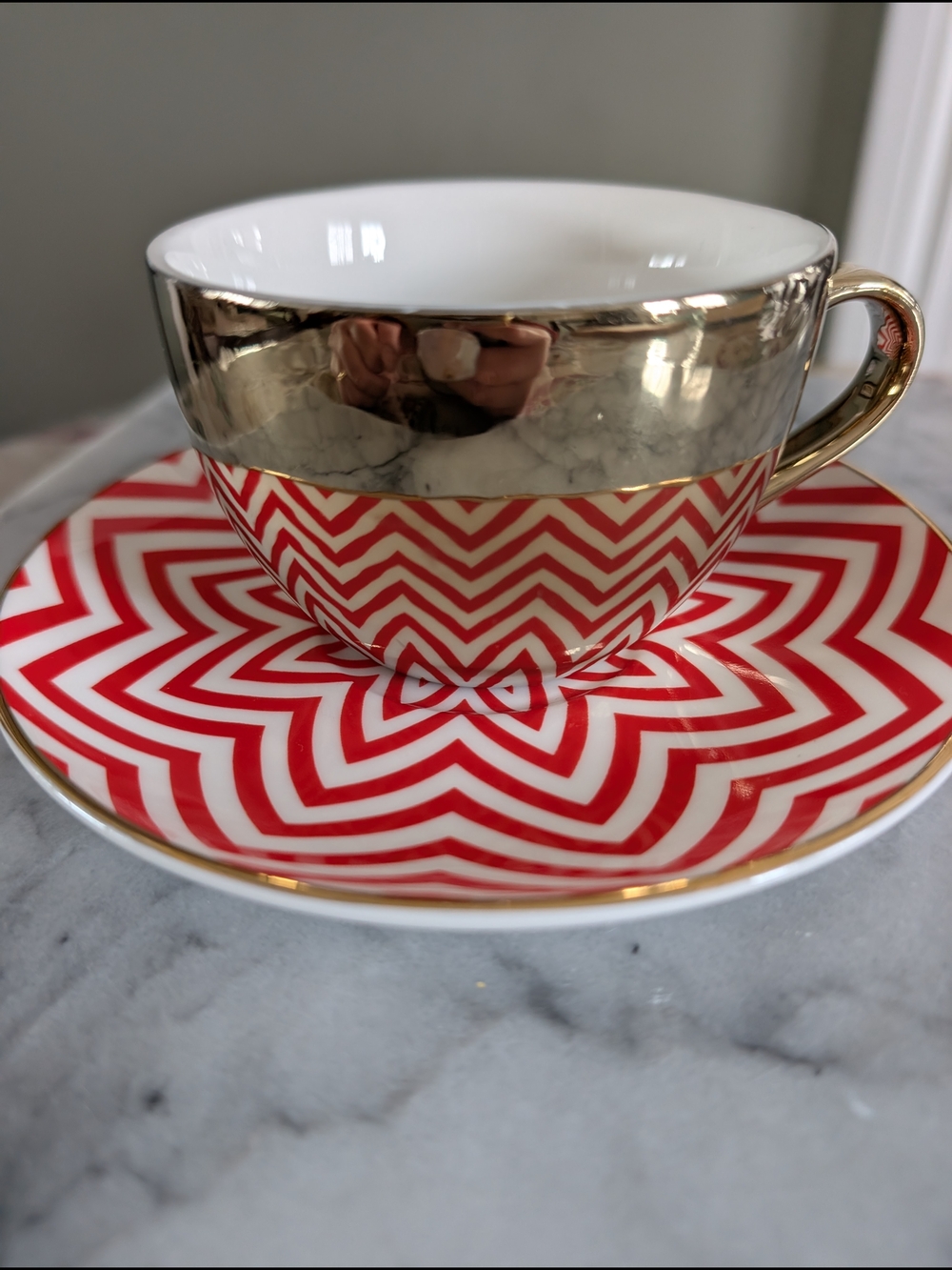 Reflections by Cirqa Anamorphic Mirror Teacup & Saucer Set - Red Zigzag